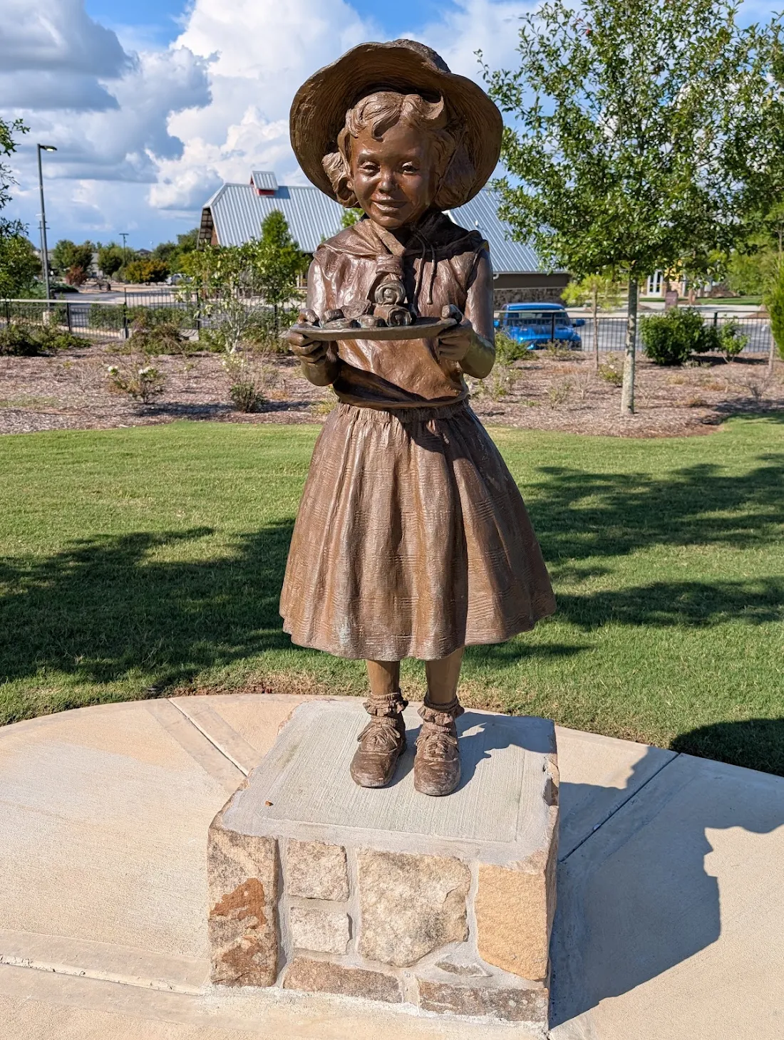 Attractions 5 Life-size Little Debbie Bronze Statue holding Swiss Rolls at Little Debbie Park in Collegedale, Tennessee